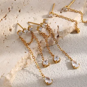 Close-up detail of 18K gold plated stainless steel tassel earrings with cubic zirconia.