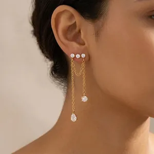 Detailed view of 18K gold plated chain tassel earrings with sparkling zircon accents