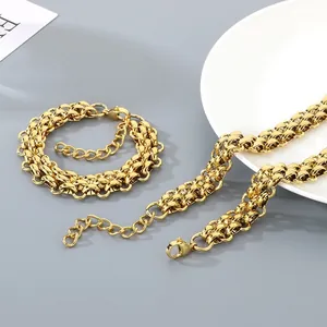 Close-up of golden triple-row woven stainless steel chain necklace and bracelet set