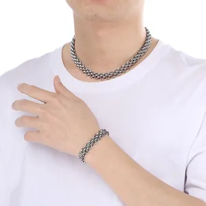Detailed view of unisex stainless steel triple-row woven chain necklace and bracelet set
