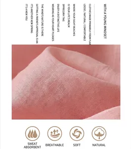 Close-up of pink ramie fabric showing breathable texture and natural soft embroidery detail