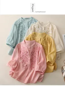 Close-up of intricate floral embroidery and texture on linen blend cardigan tops