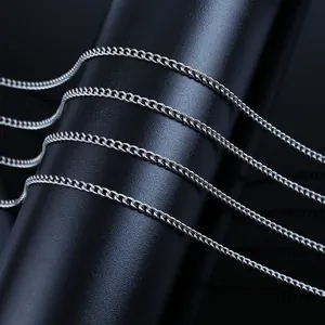 Close-up of high-polished stainless steel curb chains on black cylindrical display
