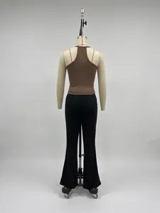 Rear view of brown ribbed knit tank top and black flared trousers on a mannequin