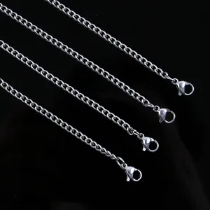 Detail of four stainless steel curb chains featuring secure lobster clasp closures