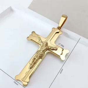 Macro shot of large golden crucifix pendant with jesus relief and 65x43mm dimensions