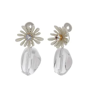 Daisy flower clip-on earrings with white petals and clear textured geometric drop