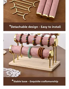 Three-tier pink velvet jewelry stand with removable bars and natural wooden base