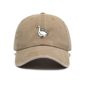 Detail of silly goose embroidery on khaki washed vintage cotton baseball cap