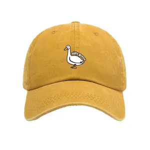 Retro washed cotton baseball cap in mustard yellow with white silly goose embroidery