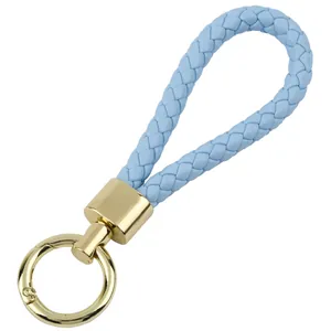 Portachiavi in pelle PU intrecciata azzurro con anello a molla in metallo dorato lucido