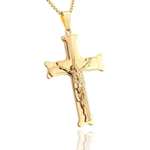 Polished gold stainless steel cross pendant necklace with grooved edges on white background