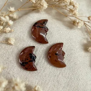 Handcarved mahogany obsidian natural stone pendants featuring a crescent moon face design