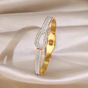 Fashionable gold-plated stainless steel cuff bracelet with sparkling zircon teardrop design