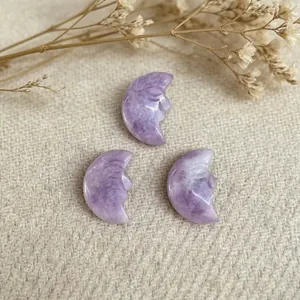 Three-piece set of purple crystal pendants with hand-carved crescent moon faces