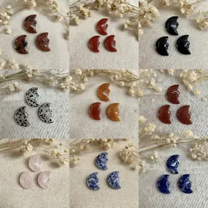 Natural gemstone moon face pendants in various crystals like obsidian and rose quartz