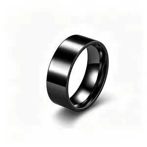 Close-up view of a glossy black titanium steel ring with a smooth mirror finish.