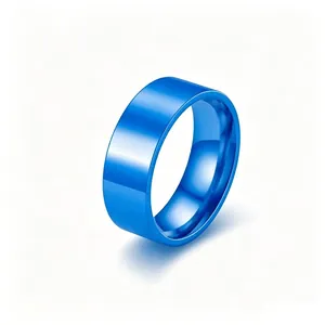 Macro view of a vibrant blue titanium steel ring with a smooth polished finish