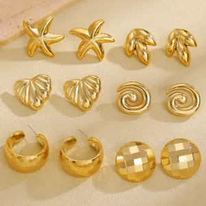 Detail of six pairs of vintage gold plated earrings featuring starfish and shell designs