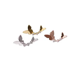 Three-color butterfly cartilage studs in silver, gold, and rose gold with zircon stones