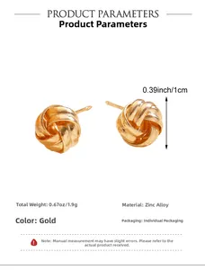Macro detail of golden knot earrings with dimensions and zinc alloy texture info