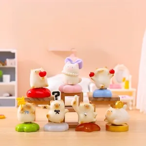 Collection of cartoon cat resin figurines on colorful bases with miniature furniture props