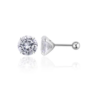 Macro detail of S925 silver stud earrings with four-prong set round cubic zirconia