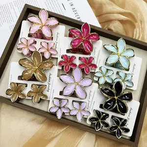 Detailed view of colorful plumeria flower hair claws in various sizes on elegant display