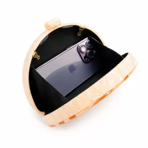 Elegant marble pattern acrylic crossbody bag shown with internal space for phone