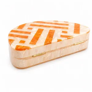 Chic marble acrylic semi-circle clutch bag with orange geometric stripes and gold hinges