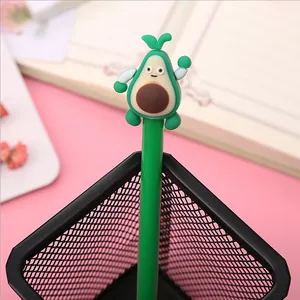 Close-up detail of a creative cute green avocado fruit topper on a student black gel pen