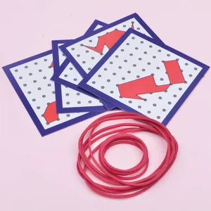 Wooden geoboard set with colorful elastic bands and geometric pattern task cards