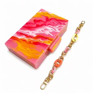Artistic marble acrylic clutch with colorful chain strap and gold hardware for women