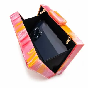 Elegant geometric acrylic evening clutch with pink marble texture and gold chain strap