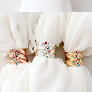 Detailed macro shot of stacked minimalist rings with multicolor crystal gemstones
