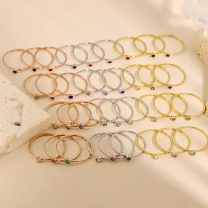 Minimalist stackable rings with colorful gemstones in gold, silver, and rose gold plating