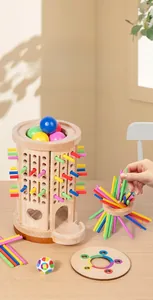 Detailed close-up of Montessori four-in-one wooden sensory toy with colorful sticks and tray