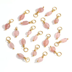 Detailed view of pink natural stone pendants with gold ring for DIY jewelry making