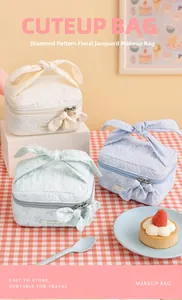 Three quilted flower makeup bags with bow handles shown in a sweet picnic table setting
