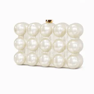 Detail view of pearlized white acrylic evening clutch with 3D bubble textured relief