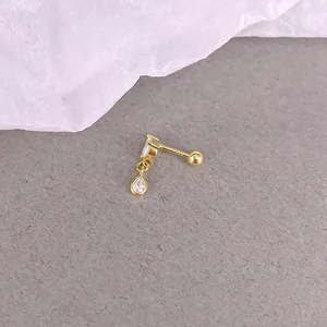 Detail of S925 silver gold stud with square zircon and pear-shaped crystal drop