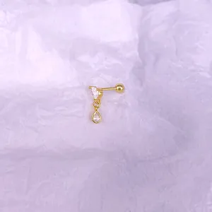 Detail view of the threaded ball back and sparkling gold teardrop zircon stud earring