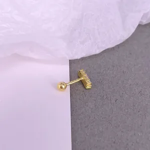 Detailed view of the gold S925 silver piercing stud with row-set zircons and screw back