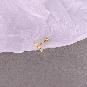 Detailed macro view of S925 sterling silver gold stud with three sparkling zircons