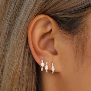 Three-piece gold plated ear cuff set featuring round pear and marquise cubic zirconia stones