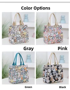 Detail showcasing cat prints on canvas bags in grey, pink, green, and black variants