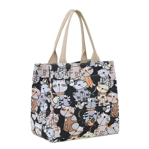 Retro canvas tote bag with cartoon cat print and durable brown handles for daily travel