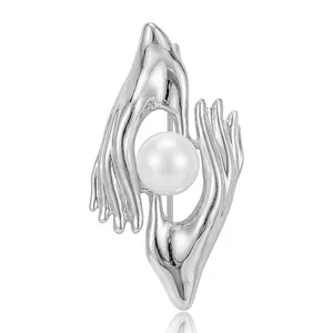 Creative silver hand-sculpted brooch featuring a lustrous white pearl accent for suits