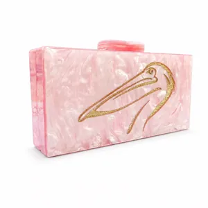 Elegant pink marble acrylic clutch bag with gold pelican design for evening parties