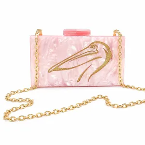 Pink marble acrylic evening clutch with gold bird motif and chain strap for weddings